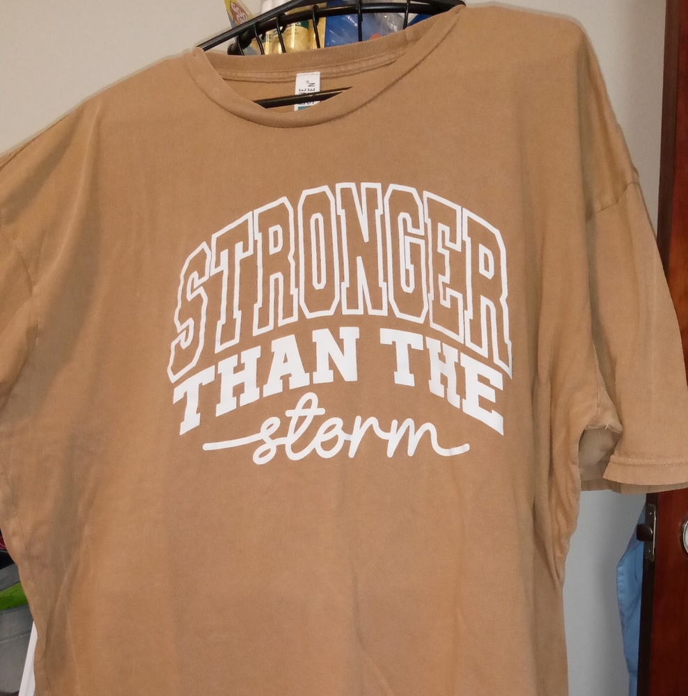Stronger Than The Storm Tan Tee